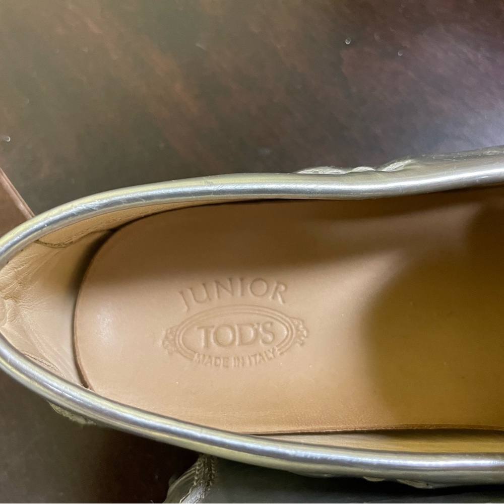 Todd’s shiny silver size 9.5